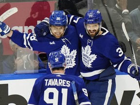 Toronto Maple Leafs' William Nylander celebrates his goal against the Boston Bruins with John Tavares and Timothy Liljegren.