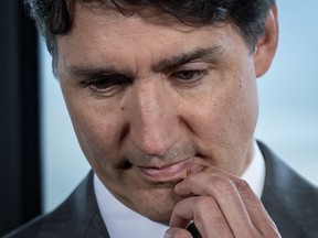 Prime Minister Justin Trudeau listens during a news conference.