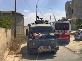 Israel Palestinians Tied to a Jeep
