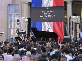 Ukrainian and Canadian pianist Anastasia Rizikov performs during the annual "Fete De La Musique" one-day music festival in the courtyard of the Elysee presidential palace in Paris on Friday, June 21, 2024.