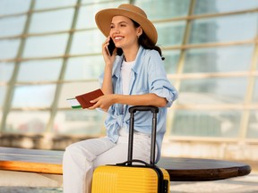 A woman uses her cellphone while travelling internationally.