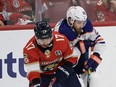 Panthers forward Evan Rodrigues and Oilers centre Leon Draisaitl battle for the puck in Game 2 of the Stanley Cup final.