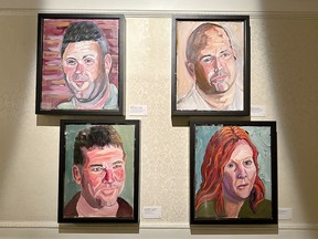 (Clockwise from top left ) Portraits of Matthews A. Ayers, Michael Politowicz, Leslie Zimmerman and James Williamson hang at the American Adventure Pavilion at Epcot as part of Portraits of Courage exhibit. (EDDIE CHAU/Toronto Sun)