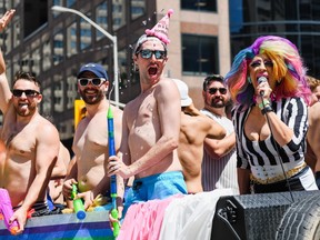 People take part in the Toronto Pride Parade on June 25, 2023.