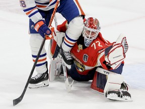 Zach Hyman of the Edmonton Oilers collides with Sergei Bobrovsky