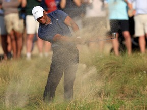Tiger Woods plays an approach shot from the rough on the 18th hole during the second round of the 124th U.S. Open at Pinehurst Resort in Pinehurst, N.C., Friday, June 14, 2024.