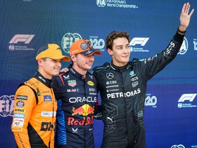 From Left: Second place McLaren's British driver Lando Norris, pole position winner Red Bull's Dutch driver Max Verstappen and third place Mercedes' British driver George Russell pose after the qualifying session on the Red Bull Ring race track in Spielberg, Austria, on June 29, 2024, ahead of the Formula One Austrian Grand Prix.