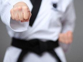 Woman with a black belt.