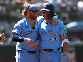 Bo Bichette (right) of the Toronto Blue Jays celebrates with Justin Turner