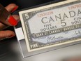 A 1954 Bank of Canada five dollar note is displayed at the Bank of Canada museum store in Ottawa on Wednesday, July 12, 2023.