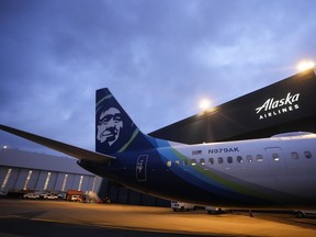 FILE - An Alaska Airlines Boeing 737 Max 9 with a door plug aircraft awaits inspection at the airline's hangar at Seattle-Tacoma International Airport Wednesday, Jan. 10, 2024, in SeaTac, Wash. The National Transportation Safety Board is sanctioning Boeing for sharing information with the media, Thursday, June 27, about the 737 Max 9 door plug investigation that it wasn't supposed to.
