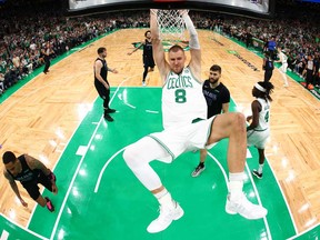 Kristaps Porzingis of the Boston Celtics dunks the ball during the first quarter against the Dallas Mavericks in Game One of the 2024 NBA Finals at TD Garden on June 6, 2024 in Boston.