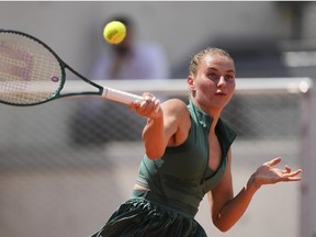 Ukraine's Marta Kostyuk plays a shot against Brazil's Laura Pigossi not pictured) during their first round match of the French Open tennis tournament at the Roland Garros stadium in Paris, Sunday, May 26, 2024.
