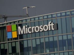 FILE - The logo of Microsoft is seen outside it's French headquarters in Issy-les-Moulineaux, outside Paris, on May 13, 2024. European Union regulators accused Microsoft of "possibly abusive" practices that violate the bloc's antitrust rules by tying its Teams messaging and videoconferencing app to its widely used business software.
