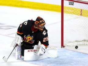 Calgary Flames goalie Jacob Markstrom is scored on for Anaheim Ducks fifth goal in third period NHL action at the Scotiabank Saddledome in Calgary on Tuesday, April 2, 2024.