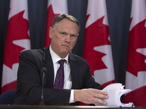 David McGuinty, chair of the National Security and Intelligence Committee of Parlmentarians, holds a news conference, in Ottawa, Thursday, March 12, 2020.