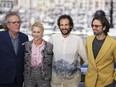 Martin Donovan, from left, Maria Bakalova, director Ali Abbasi, and Sebastian Stan pose for photographers at the photo call for the film 'The Apprentice' at the 77th international film festival, Cannes, southern France, Tuesday, May 21, 2024.