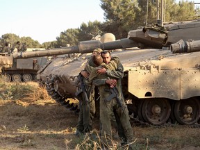 Israeli soldiers greet each other
