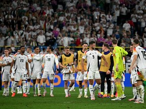 Germany's players celebrate after winning the UEFA Euro 2024 round of 16 football match between Germany and Denmark at the BVB Stadion Dortmund in Dortmund on June 29, 2024.