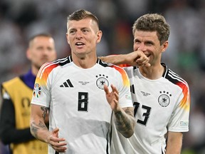Germany’s Toni Kroos and Thomas Mueller celebrate