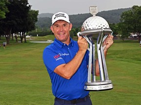 Padraig Harrington of Ireland holds the trophy after winning the final round of the DICK'S Sporting Goods Open at En-Joie Golf Club on June 23, 2024 in Endicott, N.Y.