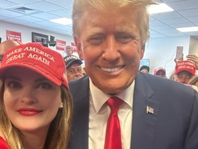 Independent journalist Heather Mullins posing with Donald Trump.