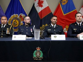 RCMP inspector Etienne Thauvette (far right), and other officers (from left: Akwesasne Mohawk Police chief Ranatiiostha Swamp, Canadian Border Services Agency assistant director Nathan Smallwood and Ontario Provincial Police inspector Walid Kandar) held a news conference Thursday to provide the results of the investigation into a smuggling ring.