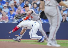 Baltimore Orioles' Ryan Mountcastle tags out BLue Jays' Davis Schneider at first base on a ground ball to third in the first inning at the Rogers Centre on June 4, 2024 in Toronto.