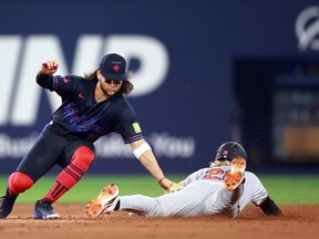 Baltimore Orioles' Kyle Stowers is caught stealing second base by Blue Jays' Bo Bichette during the second inning at Rogers Centre on June 5, 2024 in Toronto.