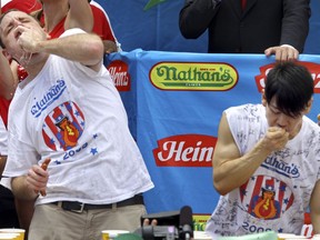 FILE - Joey Chestnut, defending champion of the Nathan's Famous Fourth of July hot dog eating contest, left, works to outpace former champion Takeru Kobayashi, right, July 4, 2009, in New York. Chestnut, a 16-time hot dog-eating champion, will face off with his frequent Nathan's competitor, Kobayashi, in a live Netflix special on Sept. 2, 2024, the streamer announced Wednesday, June 12.