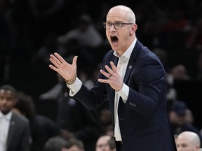 FILE - UConn head coach Dan Hurley calls towards his players during the first half of the Elite 8 college basketball game against Illinois in the men's NCAA Tournament, Saturday, March 30, 2024, in Boston. The Los Angeles Lakers' reported plan to offer a massive contract to UConn coach Dan Hurley is the latest twist in the monthlong race to replace Darvin Ham.