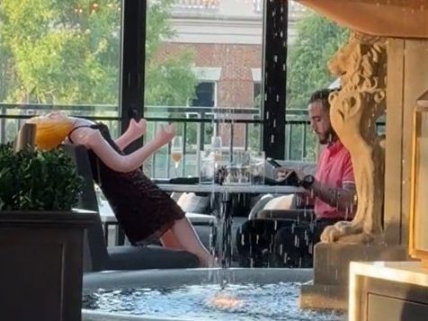 Waitress fired for sharing video of man dining with sex doll