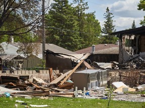 Debris is shown scattered at the scene of a house explosion in Winnipeg, Wednesday, June 26, 2024.