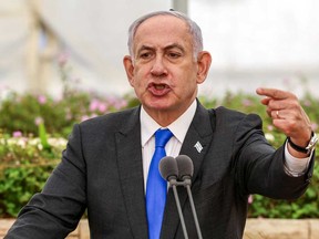 Israeli Prime Minister Benjamin Netanyahu speaks during a state memorial ceremony for the victims of the 1948 Altalena affair, at Nachalat Yitzhak cemetery in Tel Aviv on June 18, 2024.