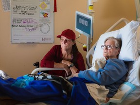 Michele Campeau, left, visits with her mother, Ruth Poupard, 83, at Hotel-Dieu Grace Healthcare where she is recovering from a broken hip, in Windsor on April 3, 2024.