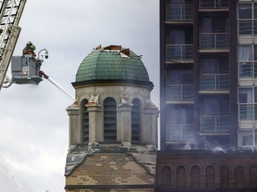 Firefighters work to put out a blaze at St. Anne's Anglican Church in Toronto's west end on June 9, 2024.
