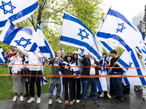 Supporters of Israel gather to celebrate the country's Independence Day in Montreal on Tuesday, May 14, 2024. A pro-Israel march is set to take place today in Toronto amid heightened security and a related protest.