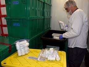 Optimi Chief Science Officer Preston Chase handles bottles of psilocybin pills ready for export.