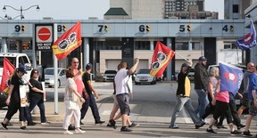 Members of the Public Service Alliance of Canada and the Customs and Immigration Union who work at Canada Border Services and supporters participate in a rally head of bargaining at the Detroit-Windsor tunnel in Windsor on Monday, May 13, 2024.