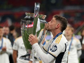 Federico Valverde of Real Madrid celebrates with the UEFA Champions League Trophy after his team's victory in the UEFA Champions League 2023/24 Final match between Borussia Dortmund and Real Madrid CF at Wembley Stadium on June 1, 2024 in London.