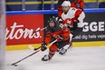 Sarah Fillier of Canada, front, in action with Shannon Sigrist of Switzerland during the IIHF world championship.