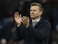 Leeds United's head coach Jesse Marsch applauds his teams travelling fans after the end of the English Premier League soccer match between Aston Villa and Leeds United at Villa Park in Birmingham, England, Friday, Jan. 13, 2023. Villa won the game 2-1.