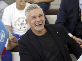 Italian soccer legend Roberto Baggio smiles as he attends an event at the Expo 2015 World's Fair on the occasion of the UN World Food Day in Rho, near Milan, Italy, Friday, Oct. 16, 2015.