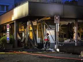 Firefighters continue to work at the scene after an explosion in an underground car park and a subsequent fire in a high-rise building at Markthof Nussbaumen, in Nussbaumen, Switzerland, late Thursday, June 13, 2024.