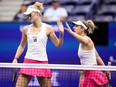 Erin Routliffe, of New Zealand, left, high fives Gabriela Dabrowski, of Canada, during the women's doubles final of the U.S. Open tennis championships against Laura Siegemund, of Germany, and Vera Zvonareva, of Russia, in New York, Sept. 10, 2023.