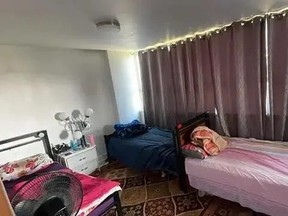Three beds in living room being rented out for $550 a month in Toronto home.