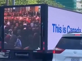 Screenshot from video of a truck carrying a message about Muslims praying in public spaces in Canada.