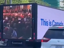 A screengrab from video posted to X of a truck carrying a message about Muslims praying in public spaces in Canada. 