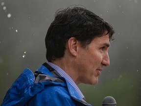 Rain falls as Prime Minister Justin Trudeau speaks during community celebrations to mark the 10th anniversary of the Tsilhqot'in decision, in Nemaiah Valley, B.C., on Wednesday, June 26, 2024.