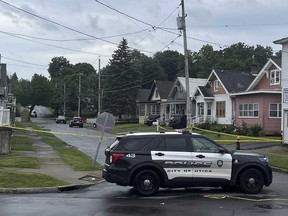 Police investigate the scene of Friday nights shooting in Utica, N.Y., early Saturday, June 29, 2024. An officer shot and killed a teen fleeing while pointing a replica gun, police said Saturday.